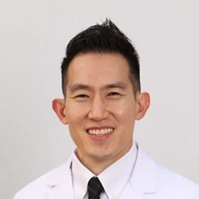 A headshot photo of dentist Jeesoo Choe